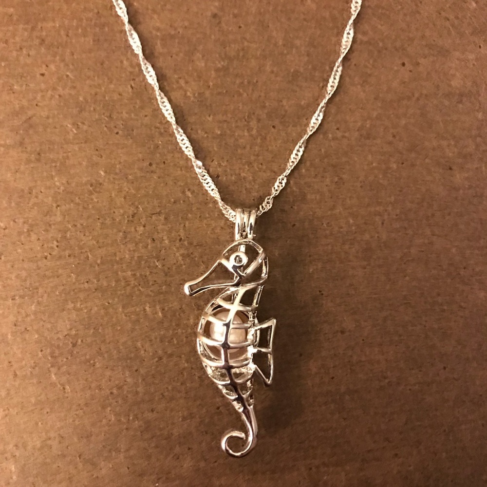 Sea horse necklace with real pearl inside